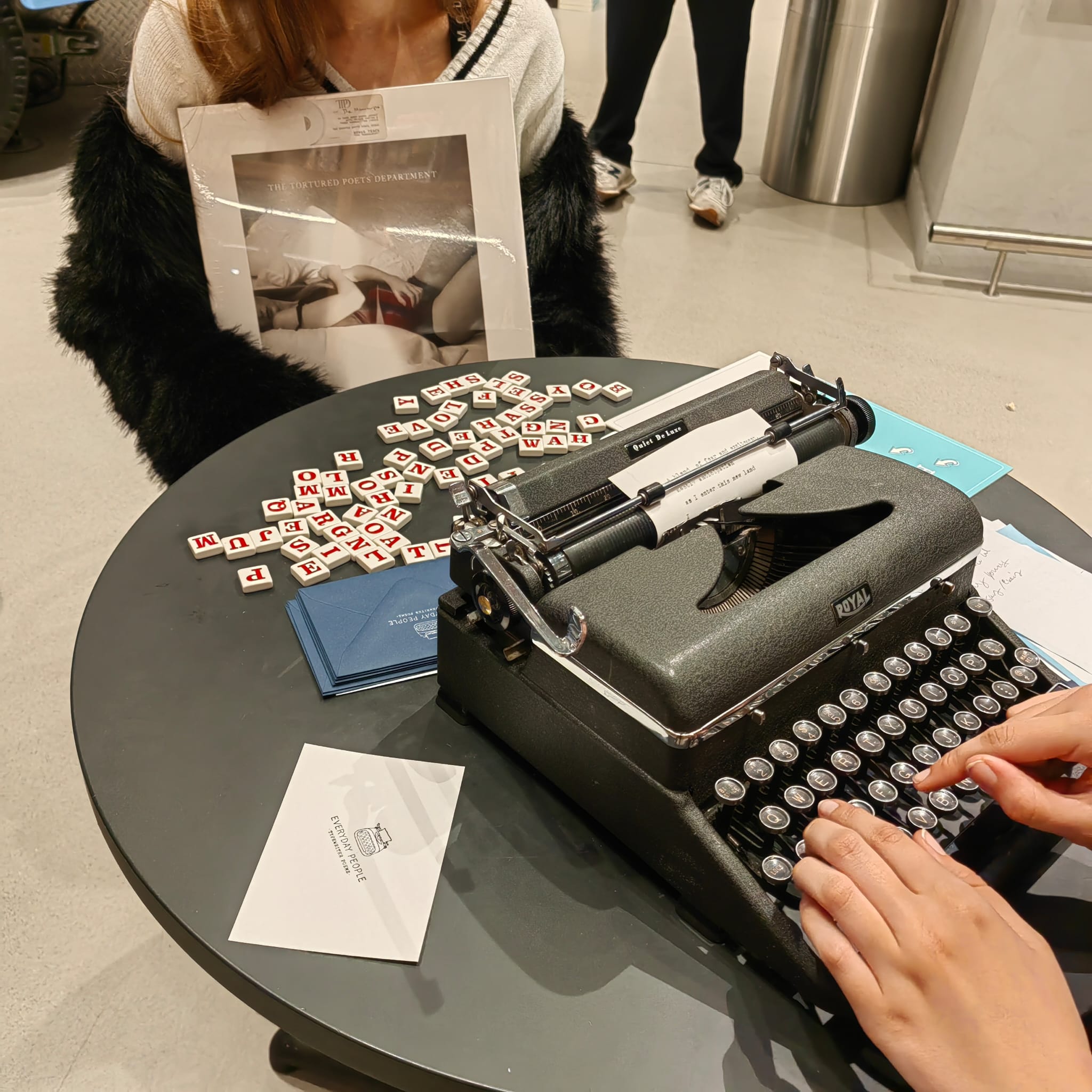 Close-up of a vintage typewriter during a live poetry in-store brand activation